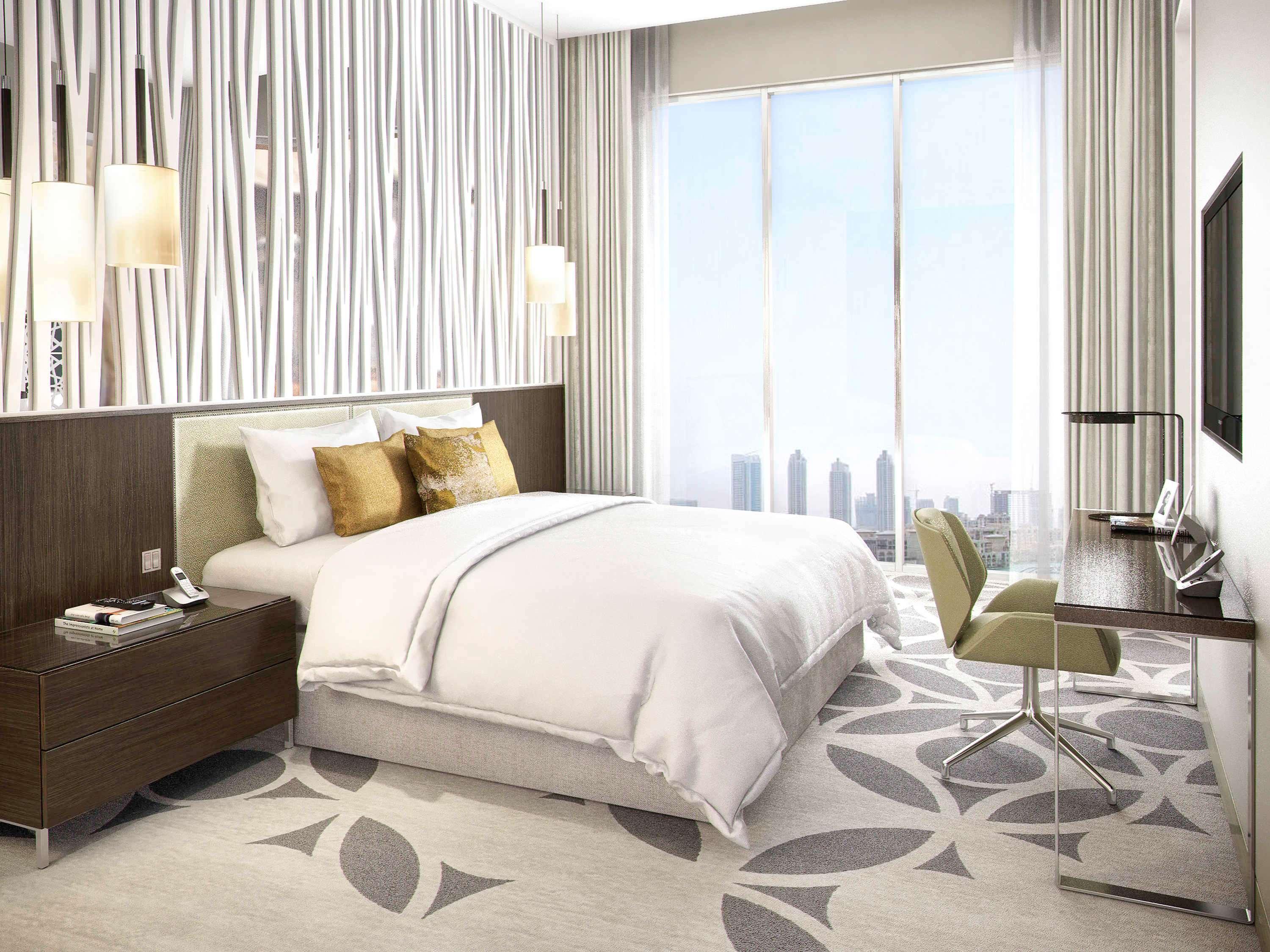 Grand Mercure Dubai City Hotel Exterior photo The photo shows a modern hotel room with a clean and stylish design. It features a large bed with white linens and decorative pillows. Beside the bed, there's a dark wooden nightstand. On the opposite side, there is a small work desk with a chair, an